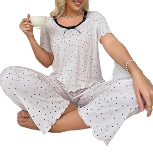 Polka dot short sleeve loungewear set with lace trim and wide leg pants for women