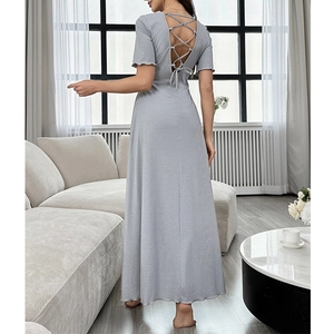 Light gray backless maxi dress with cross strap detail and elegant short sleeves