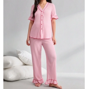 Pink two-piece maternity pajama set with ruffled cuffs and V-neck button-up top