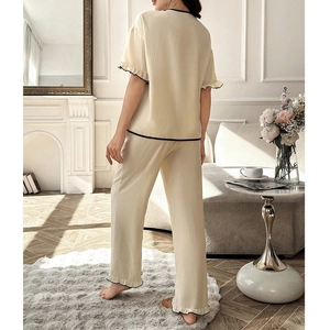 Women waffle knit pajama set with contrast trim and ruffled cuffs in beige color