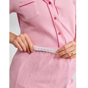 Pink V-neck maternity pajama set with ruffled edges and adjustable waist buttons