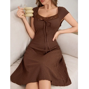 Detail of sweet brown mini dress showing lace neckline and bow knot texture