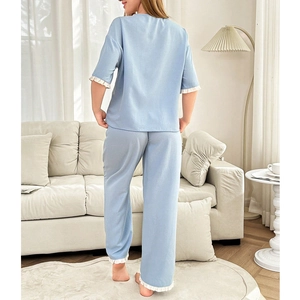 Sweet light blue pajama set with white ruffle trim and loose short sleeves for women