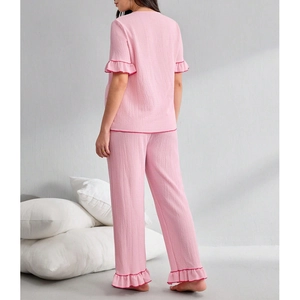 Pink V-neck loungewear set with ruffled edges and textured seersucker fabric in back view