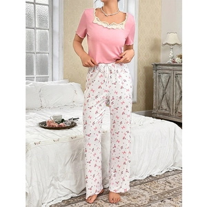 Women's pink lace short sleeve pajama set with floral print pants and drawstring