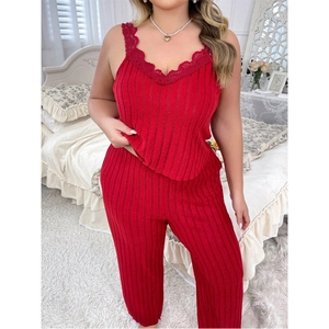 Detail view of red knit pajamas set featuring V-neck lace trim camisole and matching trousers