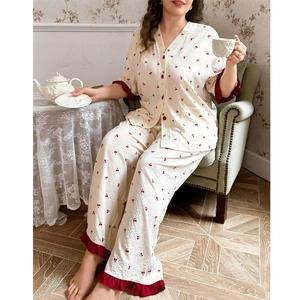 Plus size cherry print pajama set featuring V-neck top with ruffles and matching trousers