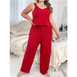 Detail of red two-piece lounge set featuring lace V-neck top and ribbed pants