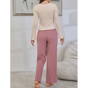 Women's rib-knit two-piece pajama set with beige long sleeve top and pink wide-leg pants