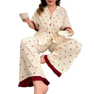 Plus size cherry print pajama set with short sleeves, V-neck, and ruffle trim trousers