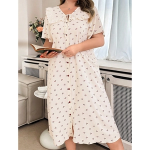 Cream-colored cherry print dress with lace collar and red buttons for summer home wear