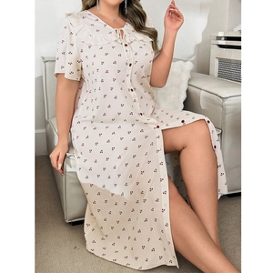 Detail of doll collar nightdress with cherry print and elegant side slit hemline