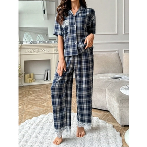 Women's two-piece navy plaid pajama set with delicate lace trim and button-down collar shirt