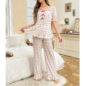 Square neck floral lace pajamas set for women with red bows and ruffle hem in bedroom setting