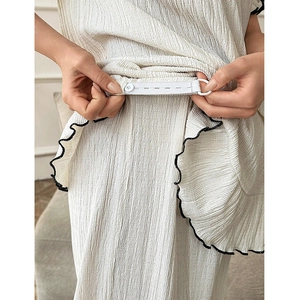 White textured maternity pajama set with black wave trim and adjustable waist band