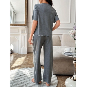 Two-piece grey lounge set for women featuring short sleeves and lettuce edge trim pants