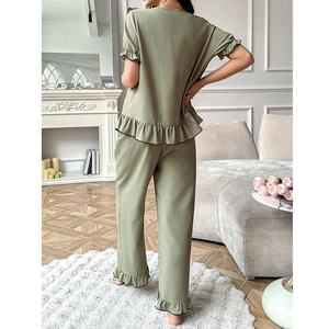 Women's green short sleeve maternity loungewear set with ruffle edges and black piping detail