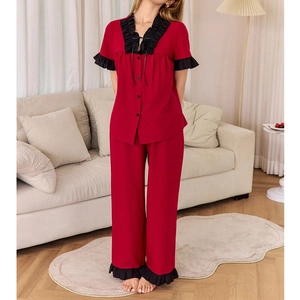 Women's two-piece red and black pajamas set with contrast lace trim and button-down top
