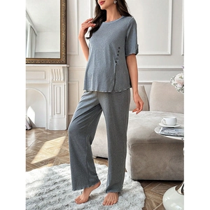 Detail view of grey two-piece maternity loungewear set with side buttons and side slits