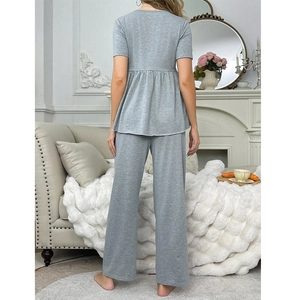 Loose grey maternity loungewear set with short sleeve pleated top and wide leg pants