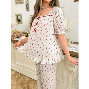 Floral square neck pajama set with lace trim and red bow accents in off-white print