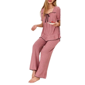 Pink ribbed square neck short sleeve pajama set with black lace trim and bow accent