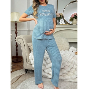 Detail view of maternity loungewear set featuring blue ribbed fabric and letter print