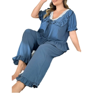 Navy blue two-piece pajama set for women with V-neck lace trim and ruffled edges