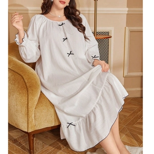 White long-sleeve oversized nightdress with black bows and ruffled hem for women