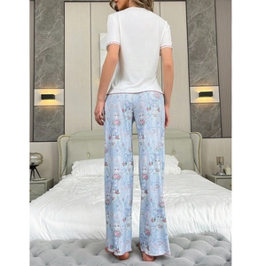 Women's pajama set featuring white short-sleeve top and cat print blue wide-leg pants