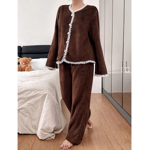 Detail of soft brown fleece pajama set with white lace trim and button-up front design