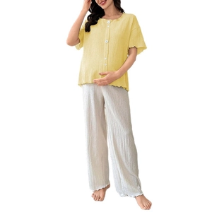 Short-sleeve maternity pajama set with pale yellow top and white textured pants