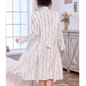 Floral loungewear set with long-sleeved robe and floral pattern in a cozy home setting