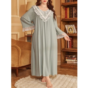 Detail of elegant white lace V-neckline and sleeve trim on a green plus size nightgown