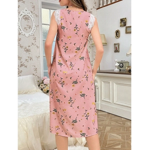 Detailed back view of a pink floral lace nightgown in a cozy vintage bedroom setting