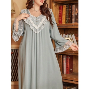 Close-up of vintage long-sleeved nightdress with floral lace collar and pearl buttons