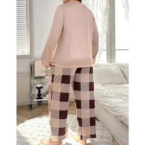 Women's two-piece pajamas set featuring pink long-sleeve top and checkered wide-leg pants