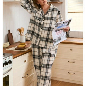 Women's plaid pajama set featuring long-sleeve button-down shirt and matching trousers
