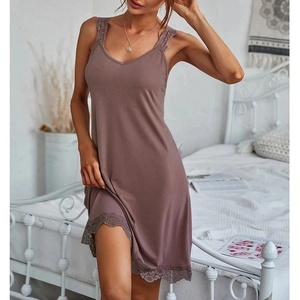 Detailed lace trim on the hem and straps of a dusty pink modal slip nightgown