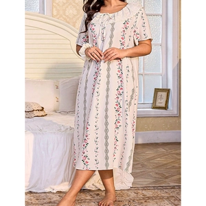 Close-up of short-sleeved floral sleepwear dress with ruffled Peter Pan collar and tie