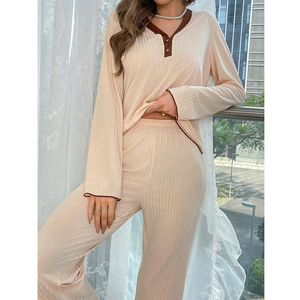 Detailed view of the V-neck pajama top with contrast piping and vertical ribbed texture