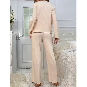 Women's V-neck pajama set in beige ribbed fabric with contrast trim long sleeves and pants