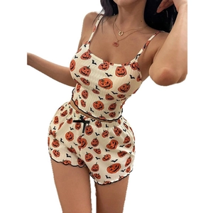 Sultry two-piece Halloween pumpkin print pajama set with camisole top and shorts