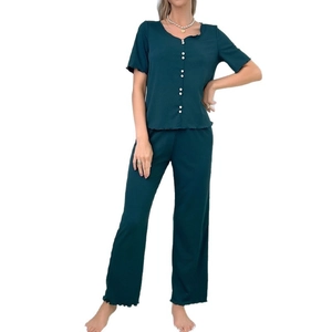 Women's pajama set featuring short sleeve button top and long pants in dark green