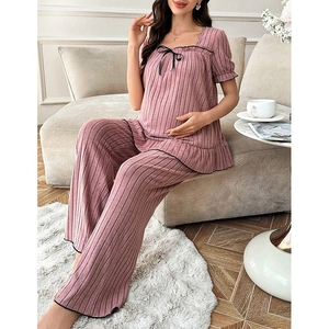 Detail of square neck maternity loungewear with ribbon bow and ribbed fabric texture