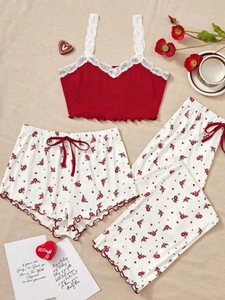 Detailed view of red floral three-piece loungewear with lace straps and soft fabric texture