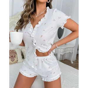 Women's floral waffle knit pajama set with V-neck, ruffle trim, short sleeve, and shorts