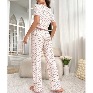 Women's two-piece floral pajama set with short-sleeved top and pants in sweet pink ruffles