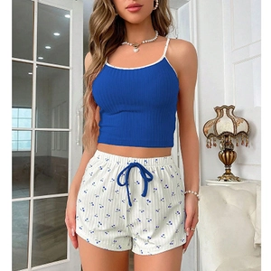 Women's 2-piece pajama set with blue ribbed camisole and white floral print shorts
