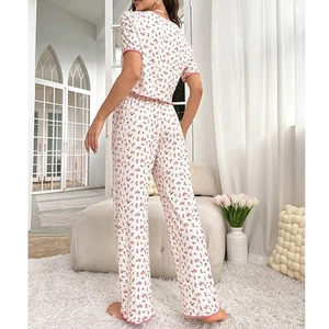 Detail of floral pajama set showing ruffled trim and soft ribbed texture on the back